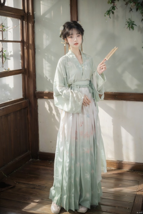  A young woman around twenty years old, dressed in Song-style Hanfu, wears a fresh green short shan that exudes a sense of purity. The red songmo complements her green and white gradient pleated skirt, blending the classical with the contemporary. Standing in an antique courtyard, sunlight filters through the leaves, casting dappled shadows on her, adding a serene and elegant aura. She holds a folding fan in her hand, the landscape painting on its surface harmonizing with her surroundings, as if she is a living classical painting., hanfu,song style outfits, 1girl,汉服