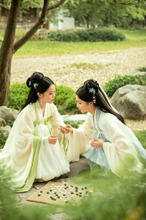 In the serene ambiance of a traditional Chinese garden, two women are engaged in a game of Weiqi. The one in white is poised, her fingers moving with deliberate grace to place a black stone on the grid. Her hanfu dress, as white as fresh snow, has a high collar but a neckline that plunges subtly to showcase her cleavage. The fabric of her dress whispers in the gentle breeze, mirroring the quiet elegance of the game.
Across from her, the woman in green is equally engrossed, her hanfu a vibrant shade that brings life to the classical setting. The dress hugs her figure, its neckline high but with a daring keyhole cutout that draws the eye to her décolletage. As they ponder their next moves, their eyes meet, and there's a spark of friendly rivalry, their shared passion for the game evident in their focused expressions.,chinese ink painting,paint splatter,ink wash painting,