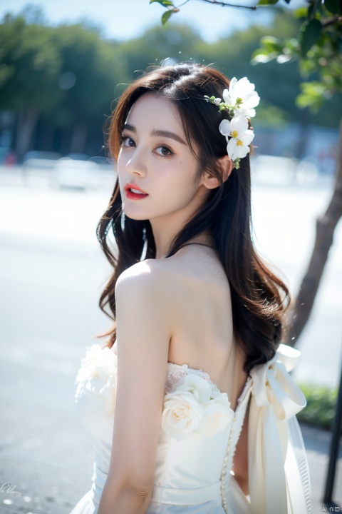  1girl, solo, long hair, looking at viewer, brown hair, black hair, hair ornament, dress, bare shoulders, upper body, flower, outdoors, parted lips, looking back, hair flower, white dress, mole, blurry, see-through, blurry background, snow, branch,wedding dress