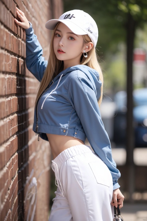  1girl, solo, long hair, breasts, looking at viewer, bangs, blue eyes, blonde hair, long sleeves, hat, hair between eyes, medium breasts, closed mouth, standing, jacket, cowboy shot, outdoors, shorts, midriff, pants, hood, from side, v-shaped eyebrows, hoodie, white headwear, arms behind back, hood down, clothes writing, baseball cap, white pants, drawstring, wall, earphones