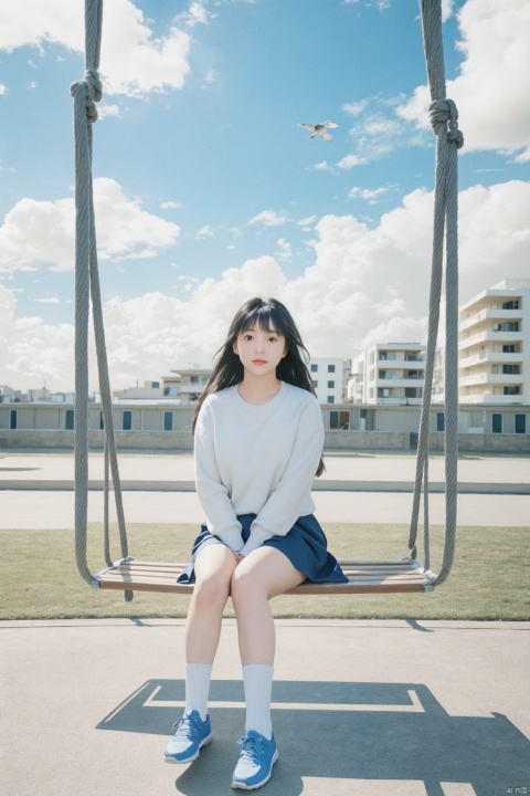 1girl,solo,sitting,sky,clouds,outdoors,black hair,bird,blue sky,white socks,daytime,building,long sleeves,long hair,playing on the swing,bangs,cloudy sky,wide_shot,hand between legs,blurry_background,