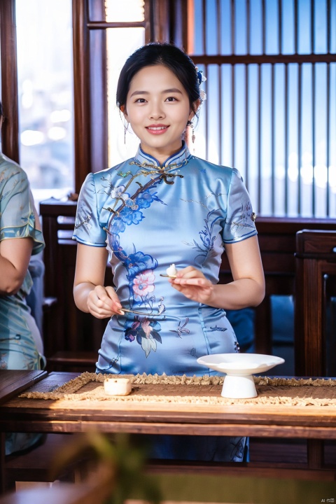 chinese clothes, black hair, table, smile, holding, dress, looking at viewer, 1girl, blurry, grin, solo focus, black eyes, short sleeves, indoors, blue dress, female focus, china dress, blurry foreground, short hair, cheongsam, realistic, south beauty