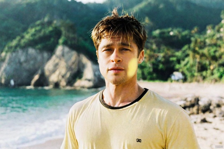  1man, beach,mountain,closeup shot,ahai,black-hair,yellow swim trunks,black eyes,(yellow t shirt:1.3),8k,head in the frame,asana,see through clothes, Brad Pitt