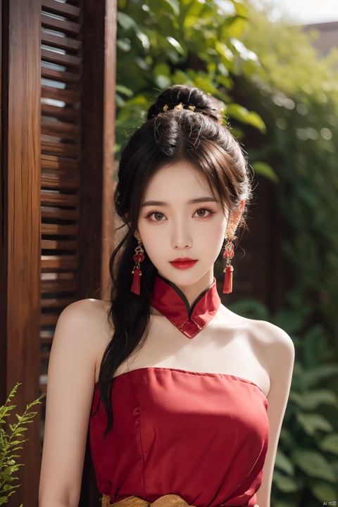  1girl, bare shoulders, black hair, breasts,Wooden wall, bush,Dai ethnic skirt, earrings, flower, garden,Chinese Dai ethnic clothing,Diagonal draped light gauze skirt, strapless dress, grass, hair bun, jewelry, makeup, outdoors, plant, red lips, solo, standing, depth of field