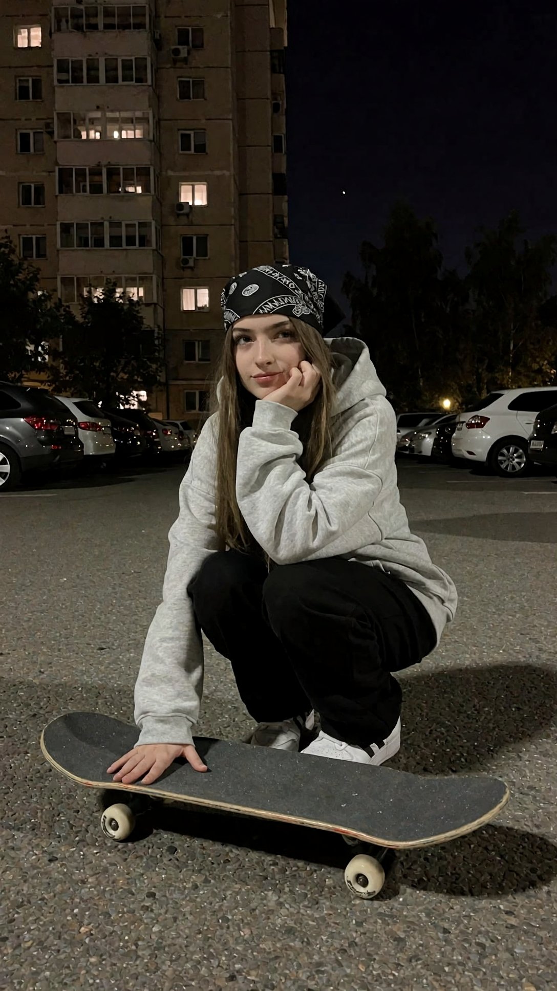r3alism,  A young woman with long hair and a black patterned headscarf crouches in an asphalt parking lot at night,  resti...
