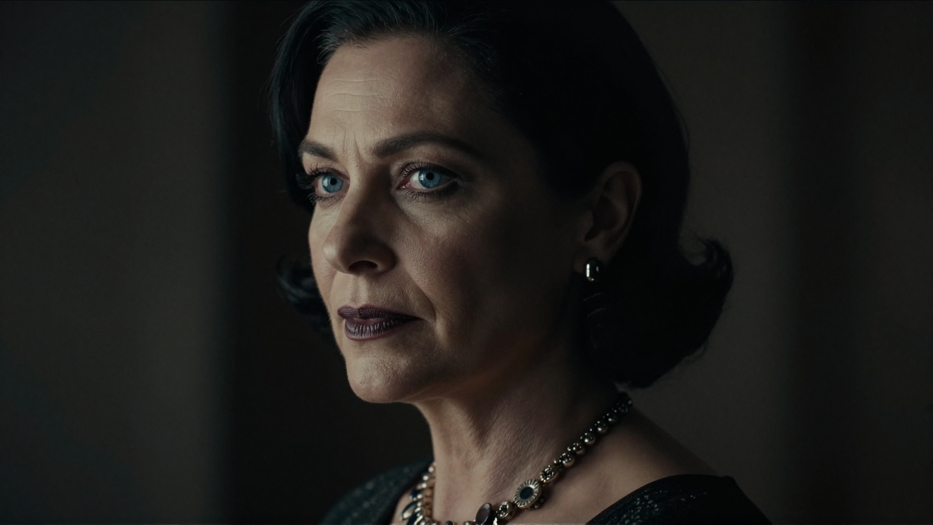 cinematic film still of Alcina Dimitrescu a closeup of a mature staring woman with a necklace on her neck,  perfect image,...