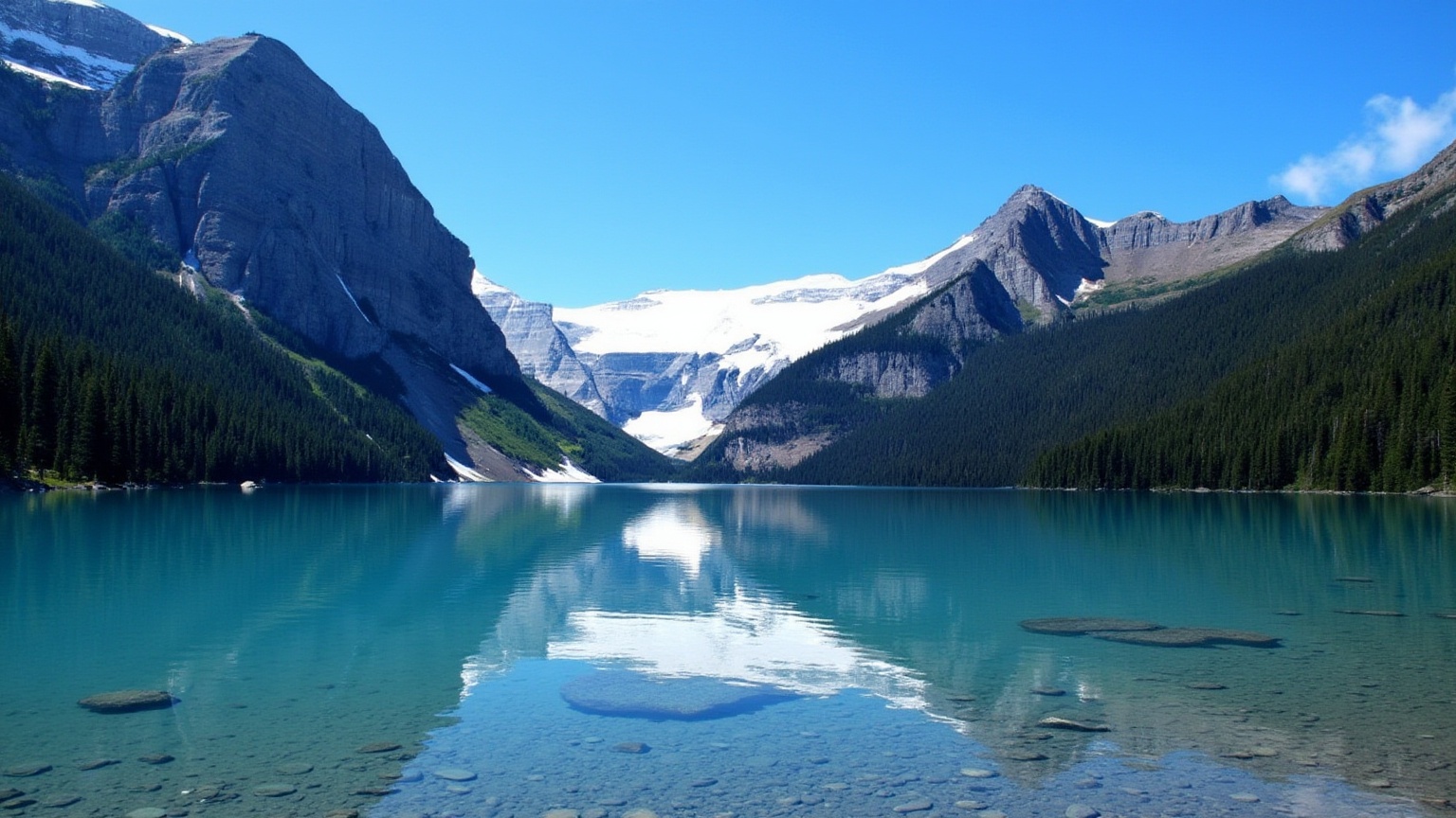 This is a high-resolution photograph capturing a serene,  reflective lake surrounded by towering mountains under a clear,...