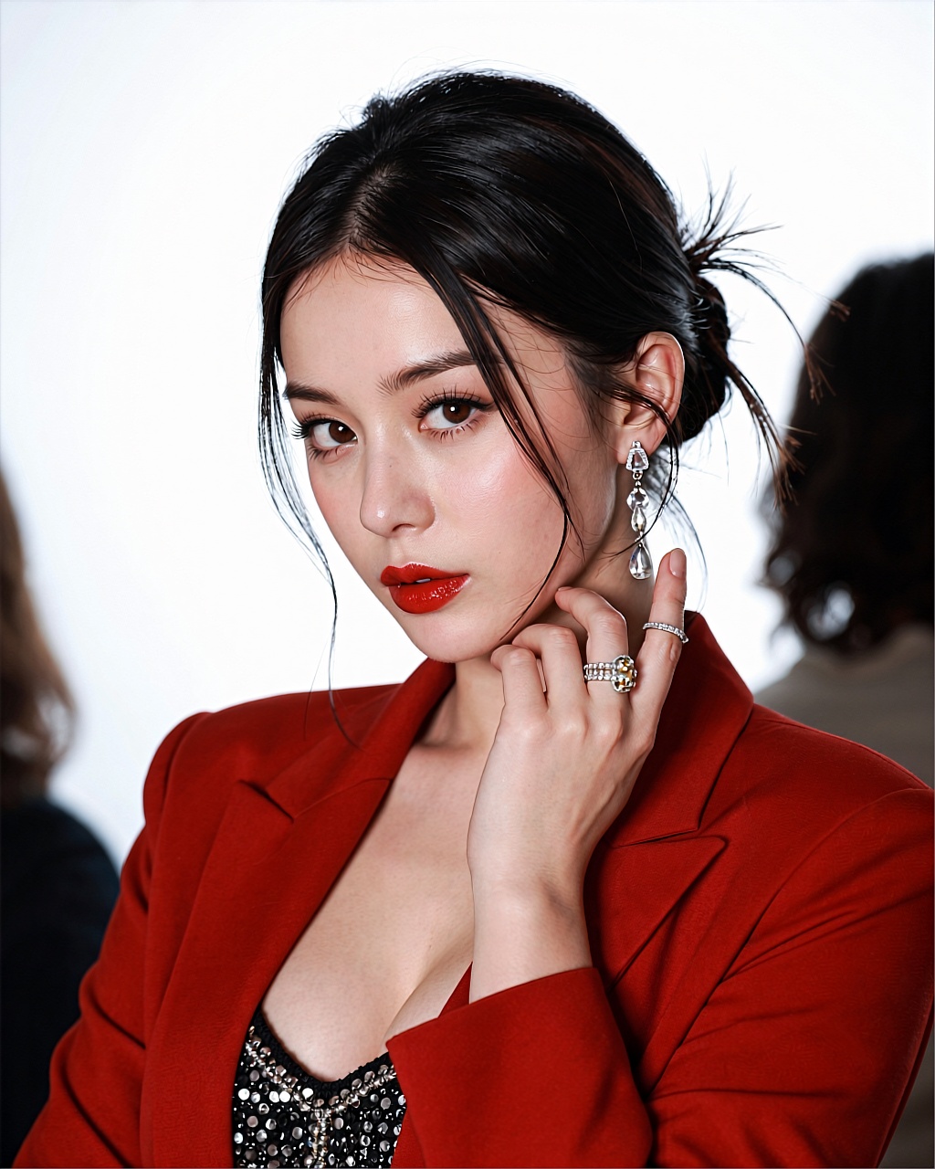 A Chinese actress with fair skin tone and almond-shaped eyes gazing directly at viewer with intense brown irises framed by...