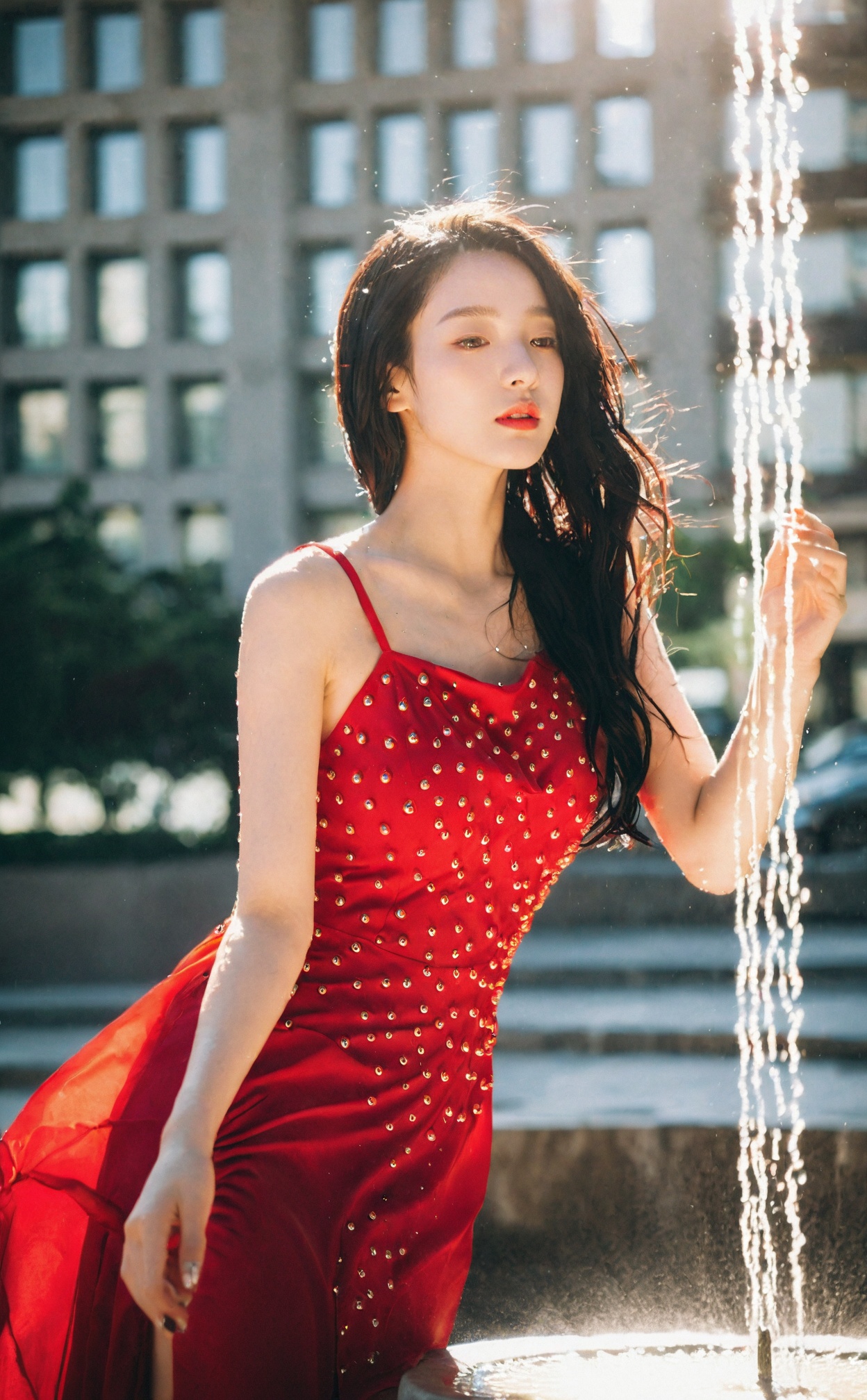 mugglelight, a woman in a red dress, posed near a city fountain with water droplets catching the sunlight, urban glamour, playful elegance.korean girl,black hair,