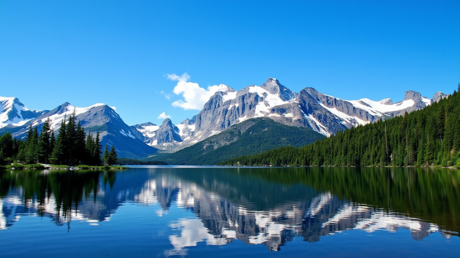 This is a high-resolution photograph capturing a serene mountain lake surrounded by lush greenery and towering mountains....