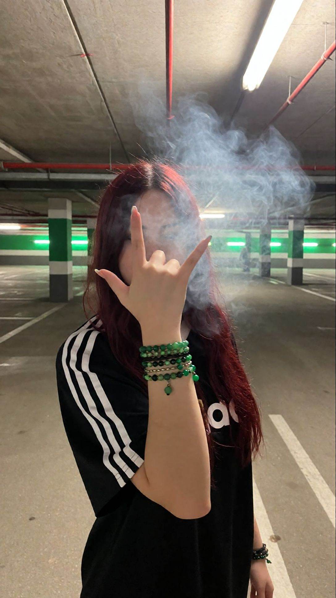 r3ealism,  A person with long,  reddish-brown hair stands in an underground parking garage on Tensor.Art