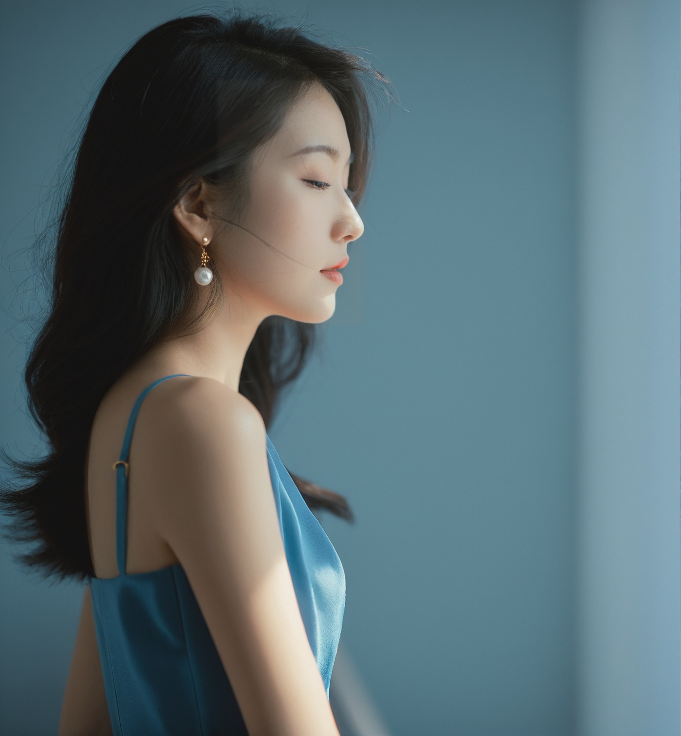 ,woman,Asian ethnicity,profile view,natural light,indoor setting,soft focus,moody,side lighting,contemplative expression,hair clip,blue dress,subtle makeup,young *****,serene,shadows,warm tones,1girl,solo,realistic,closed eyes,blurry,black hair,blurry background,closed mouth,photorealistic,lips,collarbone,upper body,portrait,depth of field,nose,<lora:15-000008:0.6>