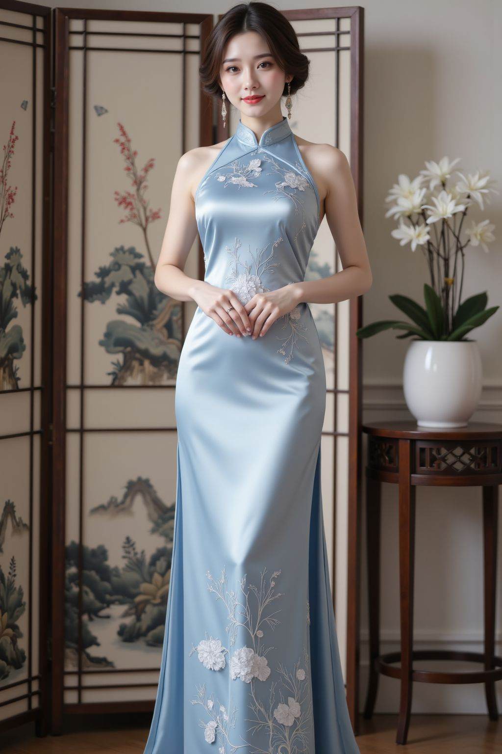 The image shows a woman dressed in a traditional Chinese-style dress,which is a silk satin gown with intricate floral embroidery. The dress is light blue and features a high neckline. She is standing in front of a decorative folding screen with a subtle landscape painting. To her right,there is a small table with a white pot containing a plant with white flowers. The overall setting appears to be indoors,with a soft and elegant ambiance.,halter neck cheongsam,cheongsam,