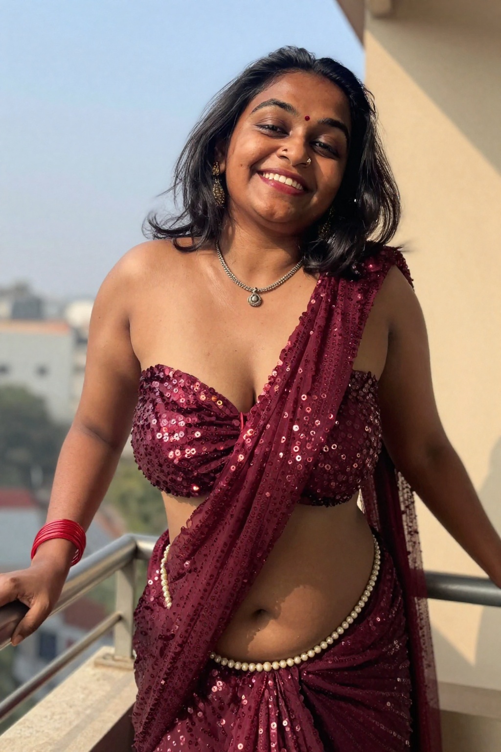 Photograph of a smiling Indian woman with medium-dark skin and black shoulder-length hair,  dramatic worm's eye shot from...