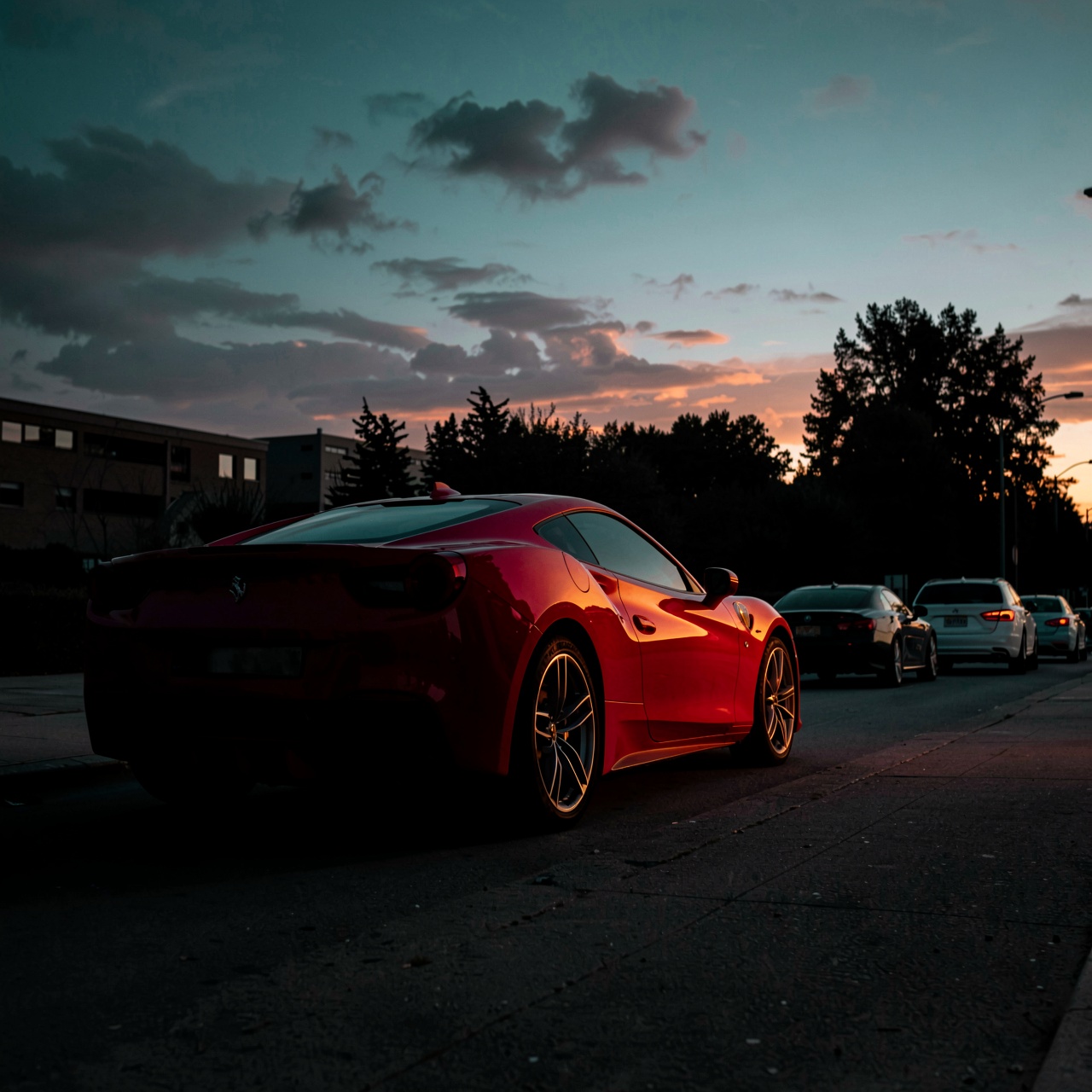 HFMAXDARK,  A sleek red sports car is parked on an urban street at twilight,  its glossy bodywork catching warm orange ref...