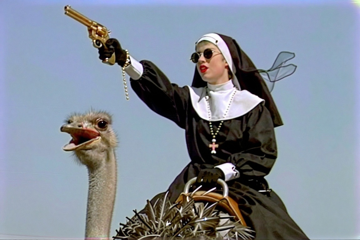 A 1990s VHS screengrab of a rebellious young nun in a black habit riding a giant ostrich. Viewed from a dramatic low angle...