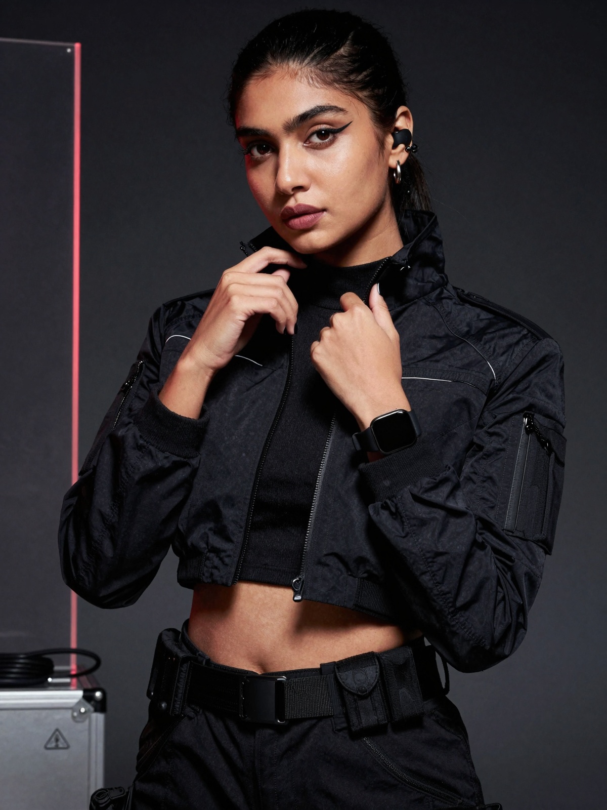 Close-up high-fashion editorial photoshoot portrait of a stunning south Asian woman in a cyberpunk-minimal tactical aesthe...