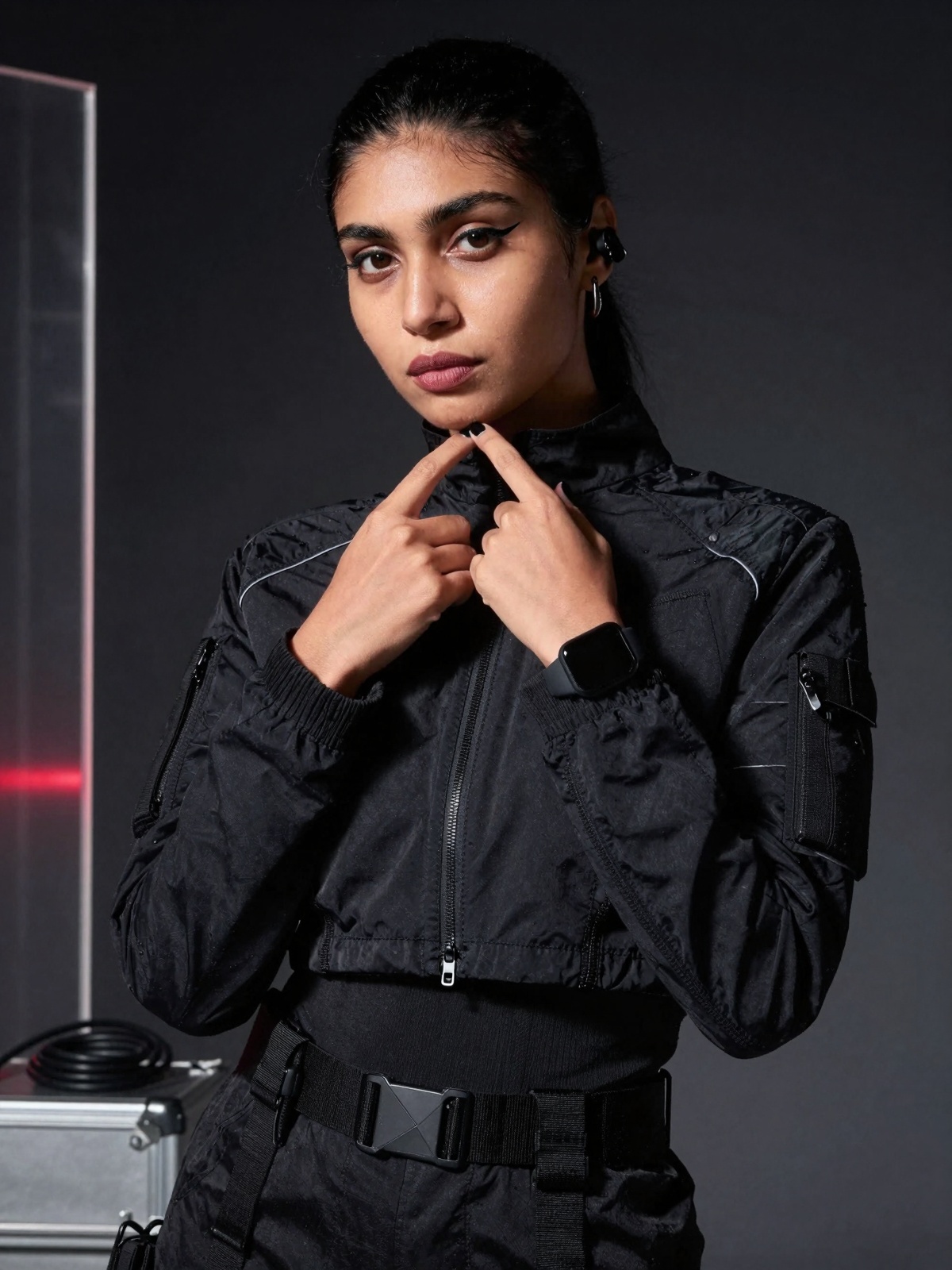 Close-up high-fashion editorial photoshoot portrait of a stunning south Asian woman in a cyberpunk-minimal tactical aesthe...