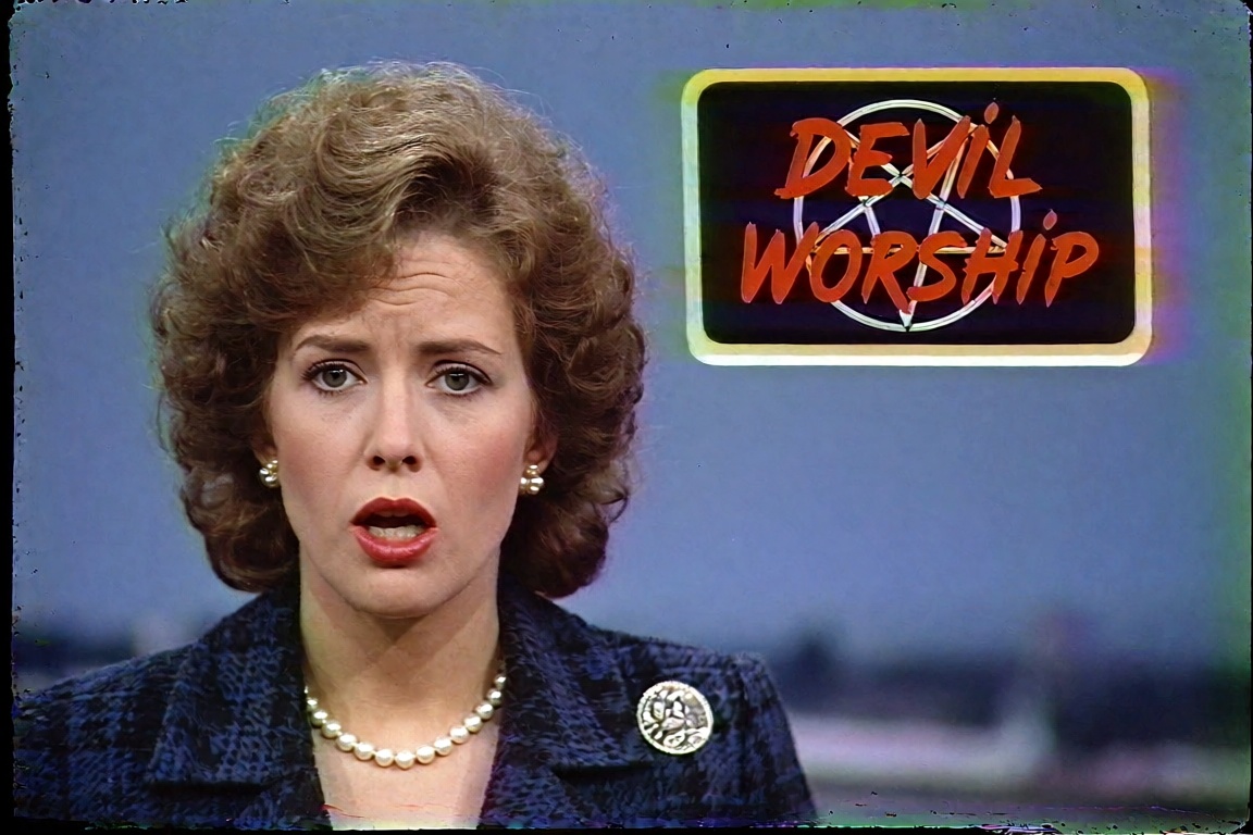 A 1980s local-TV news broadcast captured off a worn VHS tape,  4:3 aspect ratio. A female news anchor with a big teased cu...
