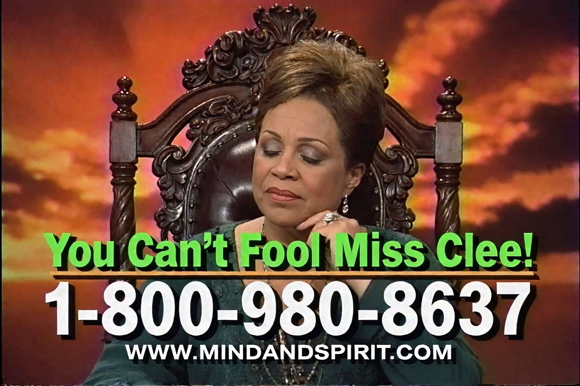 A low-resolution,  highly compressed VHS screengrab of a late 1990s television psychic infomercial. In the center,  a midd...