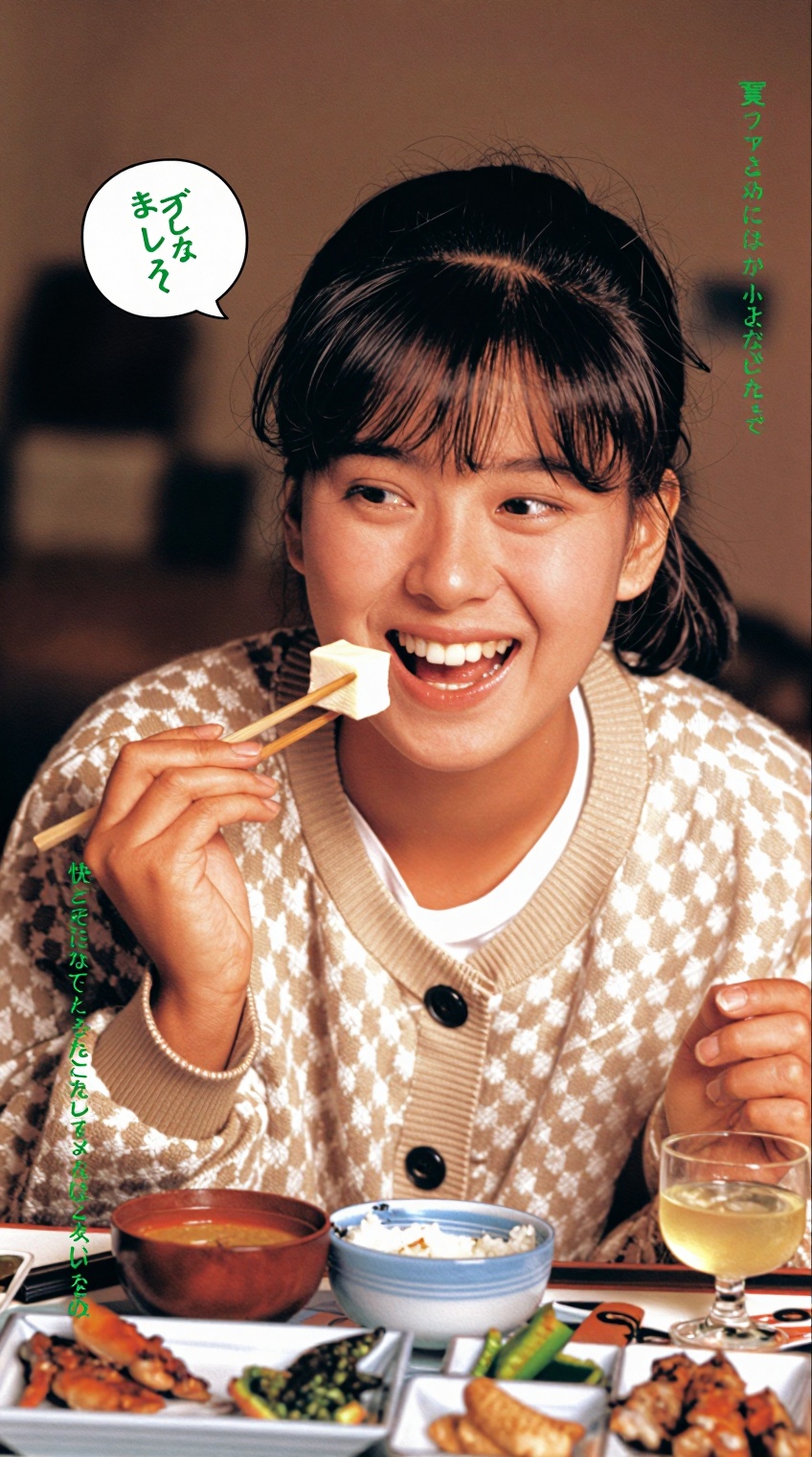 A young woman with dark hair tied back and bangs smiles broadly while holding chopsticks with a piece of white food,  like...