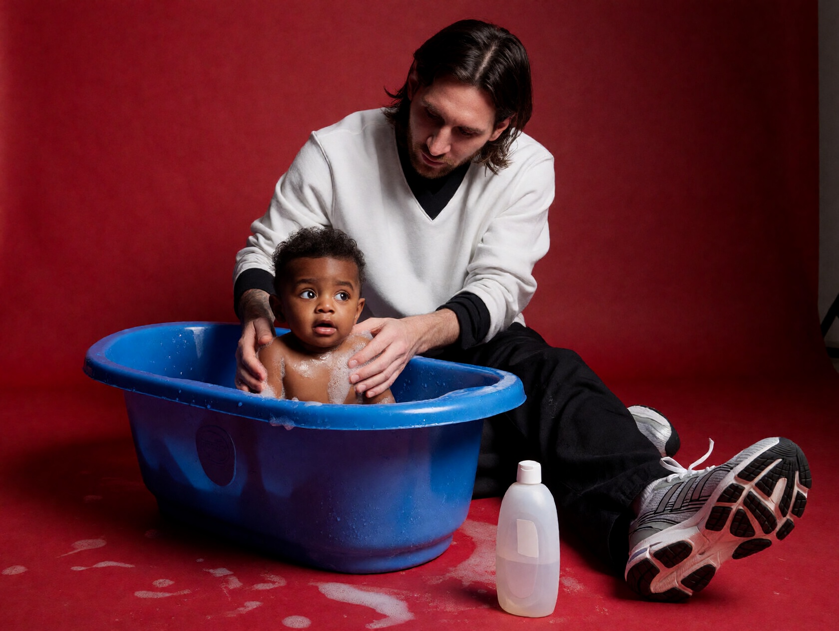 {"high_level_description":"A cinematic studio portrait of young Lionel Messi kneeling on a red floor,  gently bathing a wi...