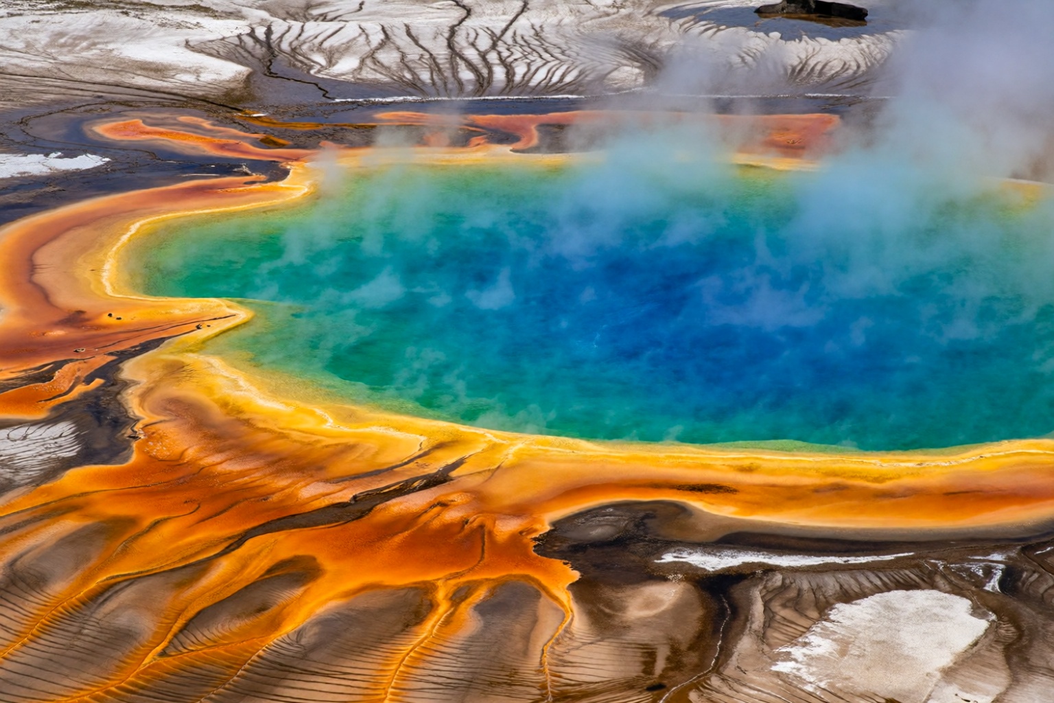 aurelmanea7k2e8 photography. An astonishing aerial or slightly elevated wide-angle view of the Grand Prismatic Spring in Y...