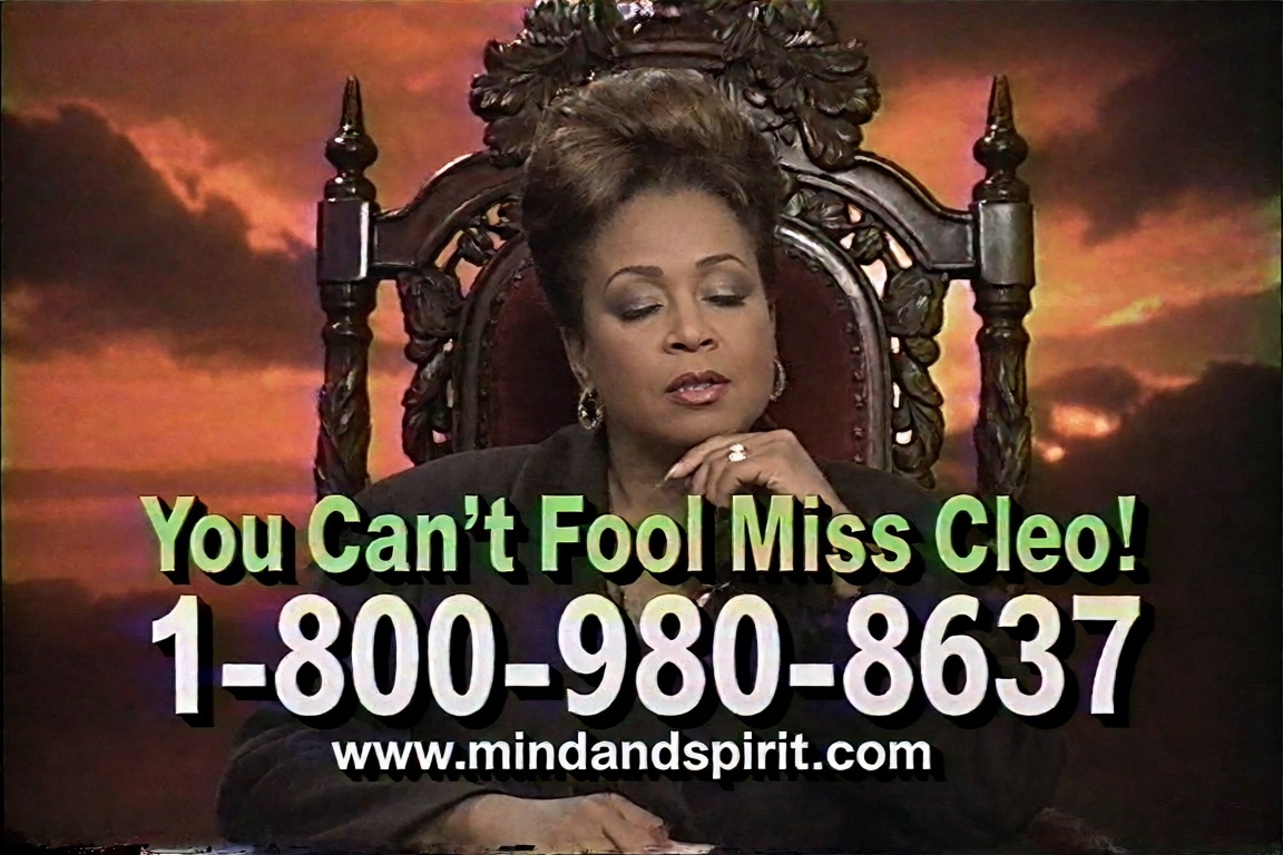 A low-resolution,  highly compressed VHS screengrab of a late 1990s television psychic infomercial. In the center,  a midd...