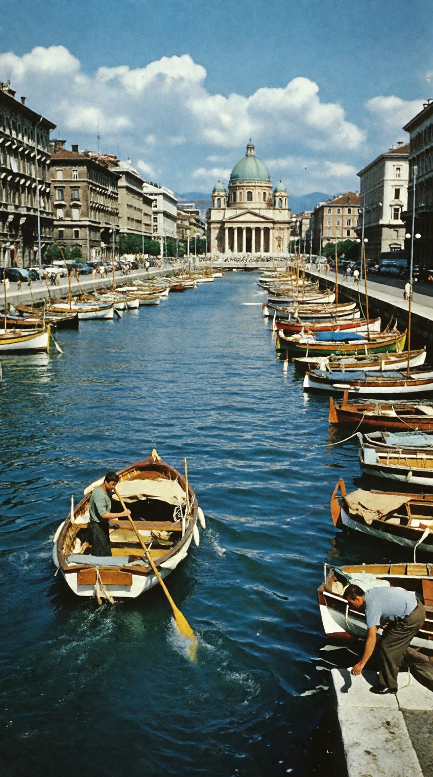 A nostalgic 1950s vintage photograph of the Canal Grande in Trieste,  Italy. In the foreground,  a fisherman navigates a s...