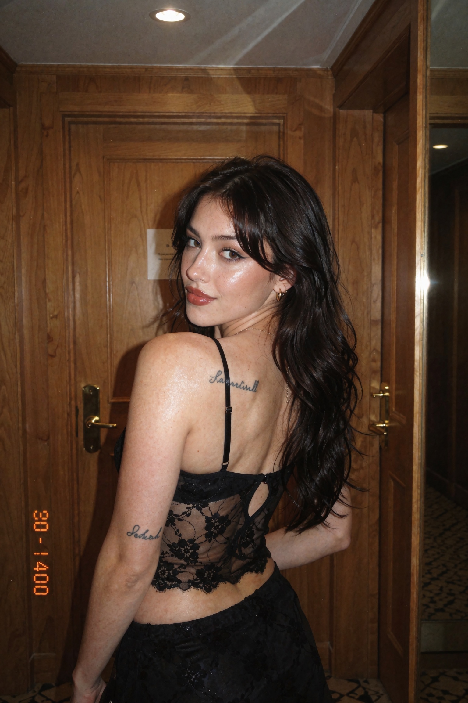 Candid documentary-style UGC point-and-shoot film snapshot of a young woman seen from behind,  glancing back over her shou...