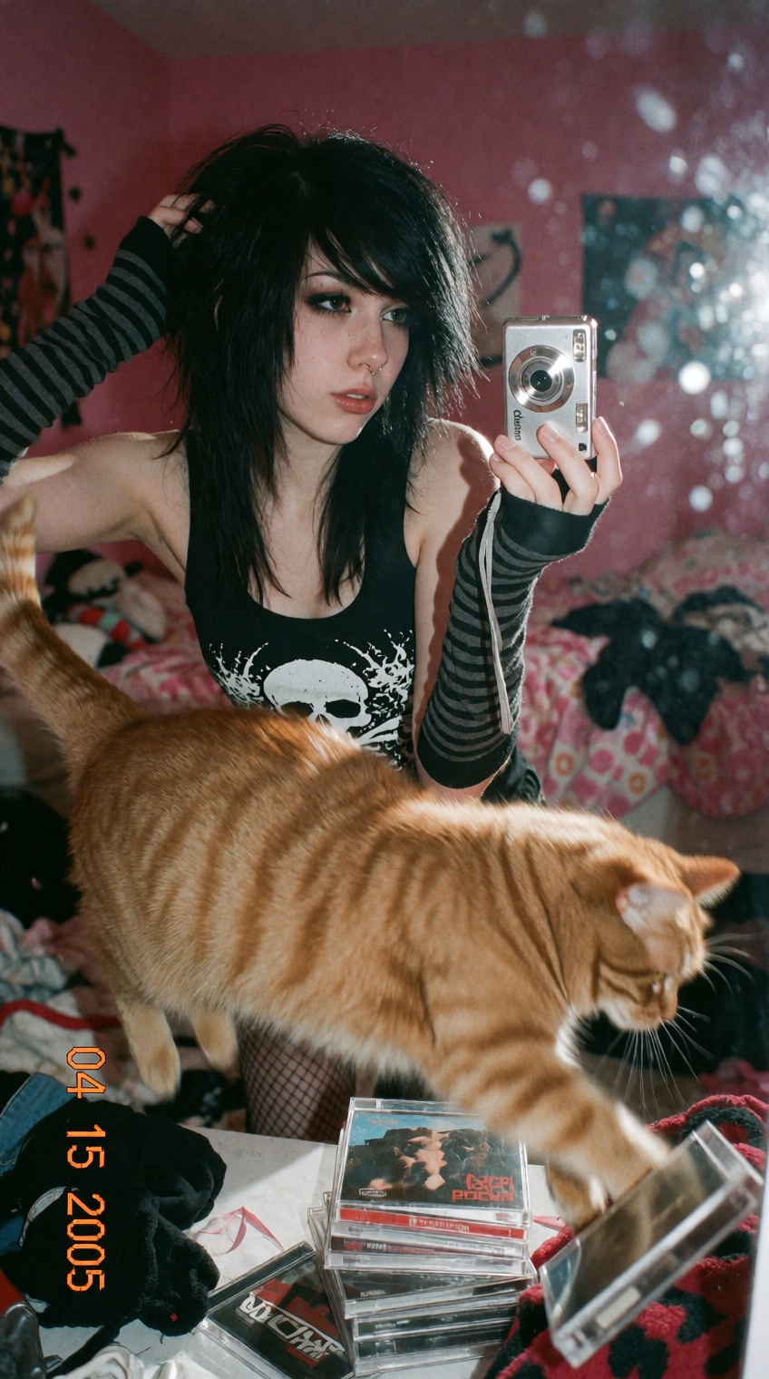 A candid mirror selfie taken in a messy teenage bedroom with pink walls. A young woman with choppy,  dyed black layered ha...