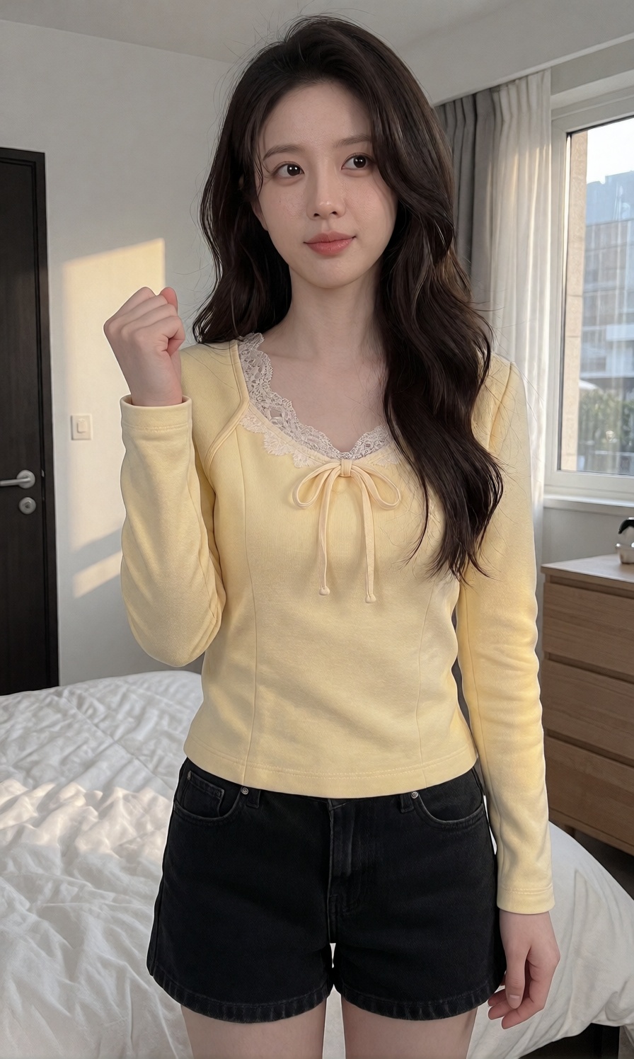A young woman with a large breast is dressed in a light yellow long sleeved pullover top with a delicate lace camisole nec...