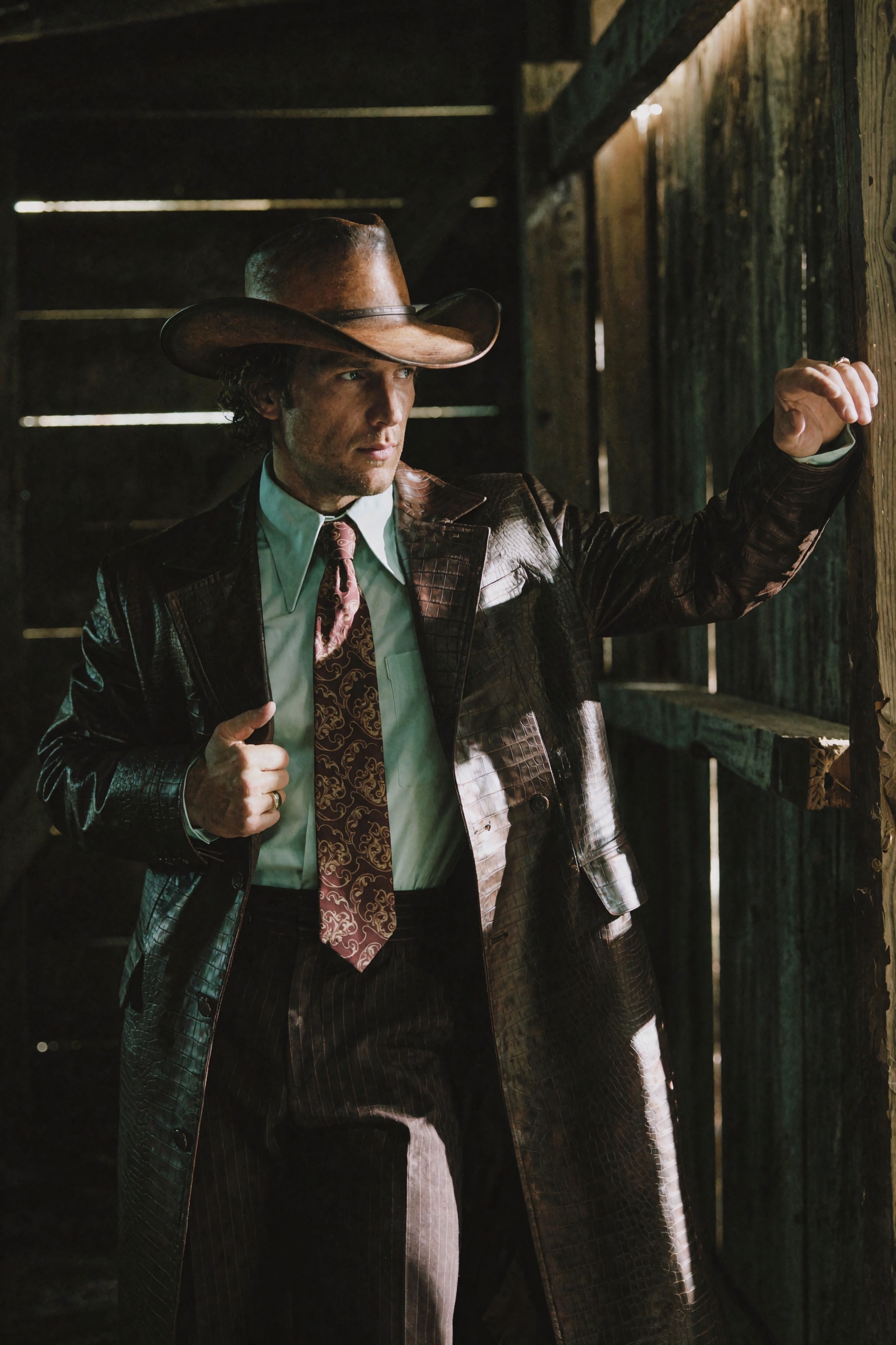 Cinematic western-noir editorial photograph of a man standing inside a dark wooden structure,  body facing forward with he...