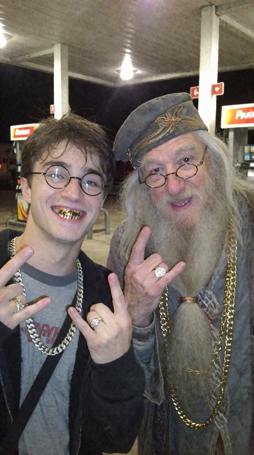 A candid night snapshot at a brightly lit gas station forecourt. In the foreground,  a young man resembling Harry Potter w...