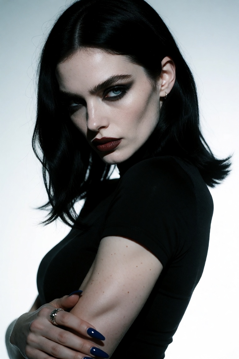 This is a photograph of a woman with a striking,  intense gaze,  looking directly at the camera. She has pale skin on Tens...