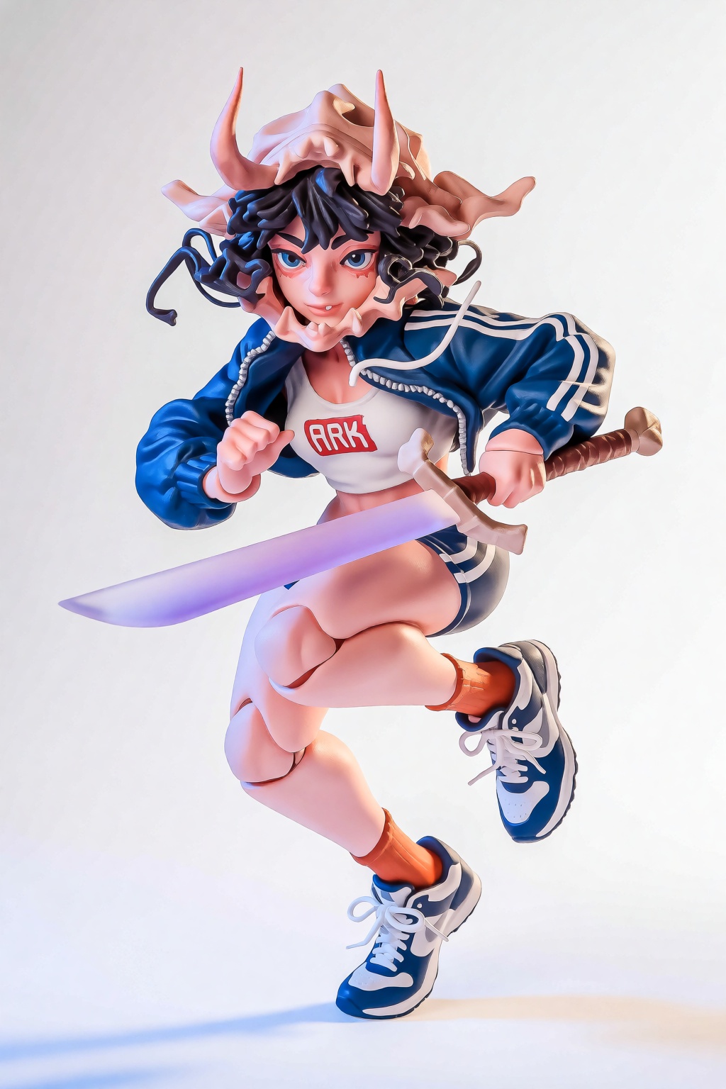 {"high_level_description":"A dynamic,  high-gloss 3D designer toy of a female warrior sprinting forward. The character fea...