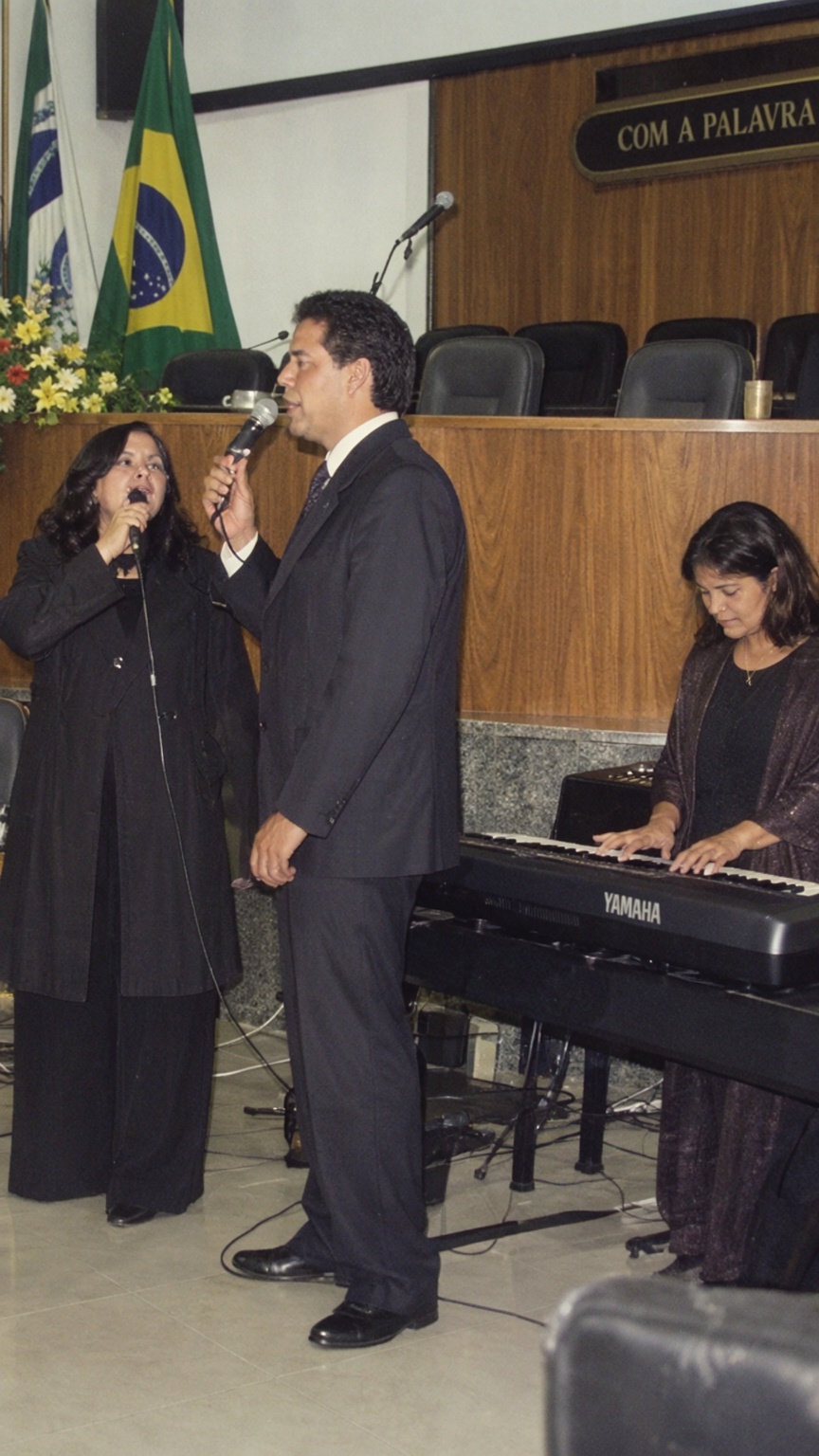 this image captures a musical performance taking place in what appears to be a formal or semi-formal setting,  possibly a...