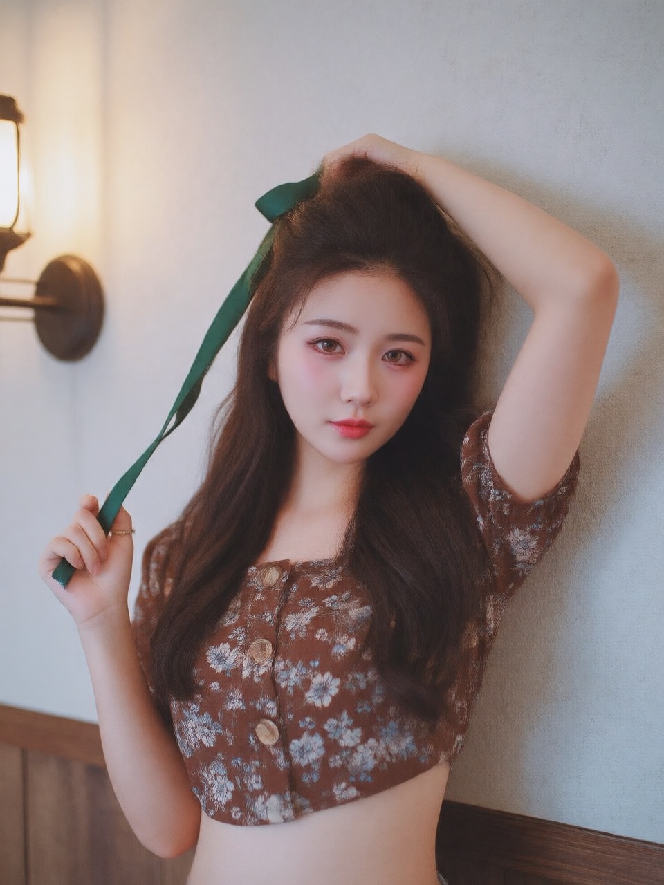 This photograph captures a young woman with a fair complexion and long,  wavy brown hair that cascades past her shoulders....