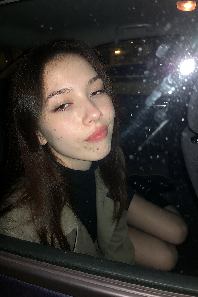 A candid ******* snapshot of a Chinese woman in her early 20s with long dark hair flattened against the glass and red lips...