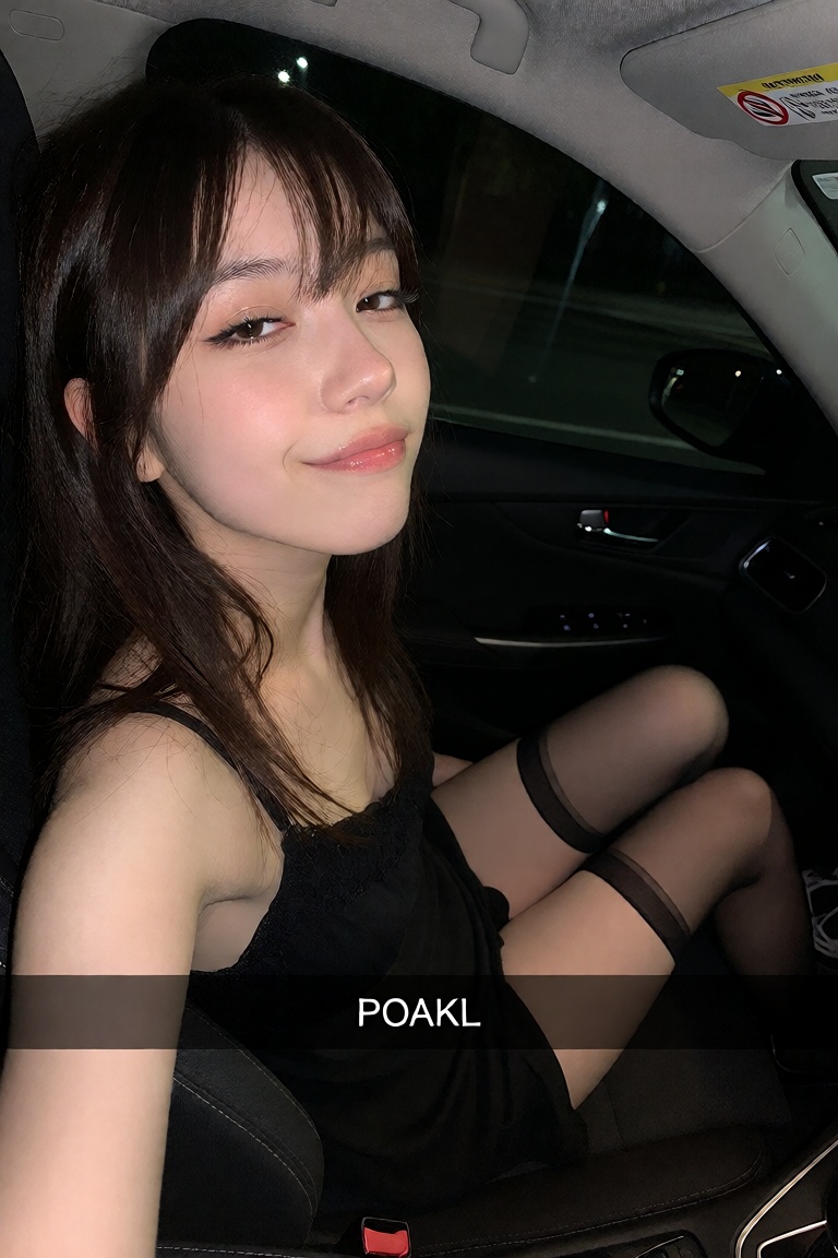 A candid ******* close-up selfie of a Japanese woman in her late 20s with pale skin and glossy dark hair,  sitting in the...