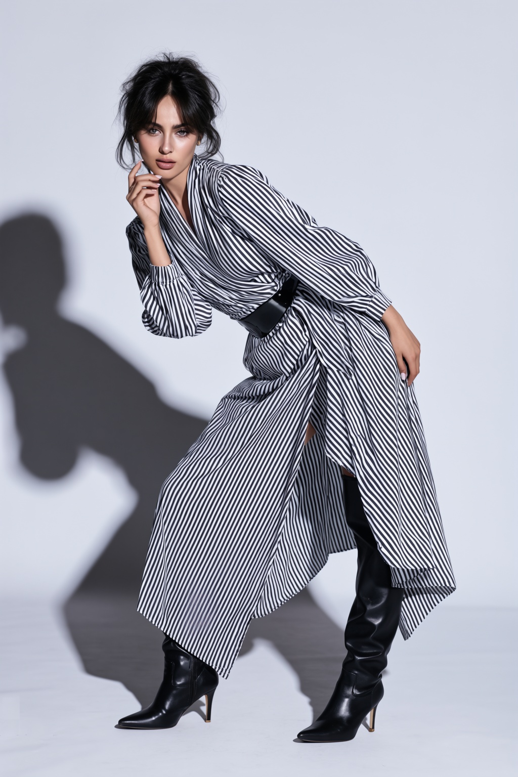 A beautiful 22-year-old ASIAN woman posing dynamically in a minimalist photography studio,  wearing a dramatic black-and-w...