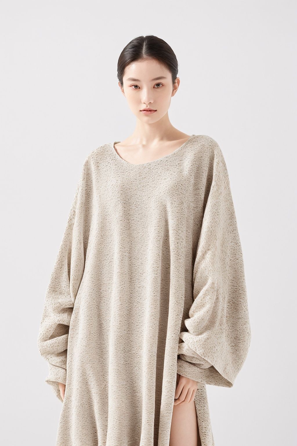 (a portrait of a woman:1.2), ([large clothes : marble texture]:1.4), (low contract:1.1), realism, professional photo, studio shot, modern fashion, (simple background:1.3), detailed, (minimalism:1.1)
