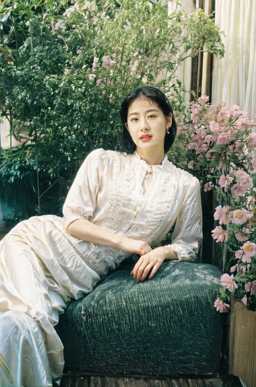 (best quality, top quality, masterpiece), RAW photo, (photorealistic, hyperrealism), beautiful and aesthetic, official art, cinematic shot, intricate detalis, ultra-detailed, (fashion campaign), 1930s french, (retro style), Vogue, Elle, artistic, fashion-forward, high fashion, vivid, colorful, pastel tone, (alluring girl), (|blonde:1.05), beautiful and detailed face, shiny glossy skin, (2$$|eyelashes|mole:1.05), voluptuous, (|indoor|outdoor:1.05), flowers, plants ((fullbody)),  <lora:film styleLora_v20:1>