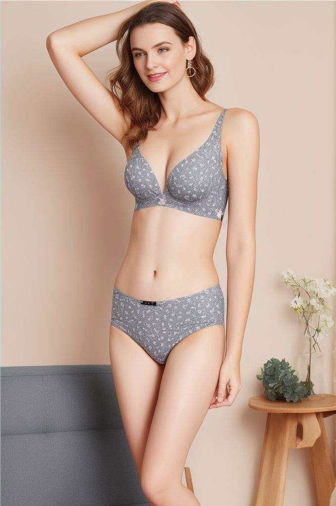 <lora:bodypops2:0.7>, The woman is wearing gray panties with floral print. She has her hands on her hips while posing for the camera.