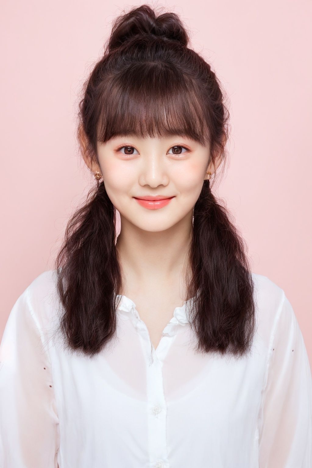 ID photo, NSFW,(a 5-year-old girl: 1.5), solo, upper body, ponytail, (big watery eyes: 2.0), (chubby face: 1.5), (beauty mole: 1.5), white shirt, peach blossom, tender skin, she smiles at the camera, (pink solid background: 1.5), cute blue_IDphoto