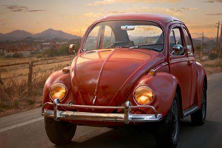 analog gloomy photo of a (dark red) Volkswagen Beetle car,  ,  ((three quarter view)) on Tensor.Art