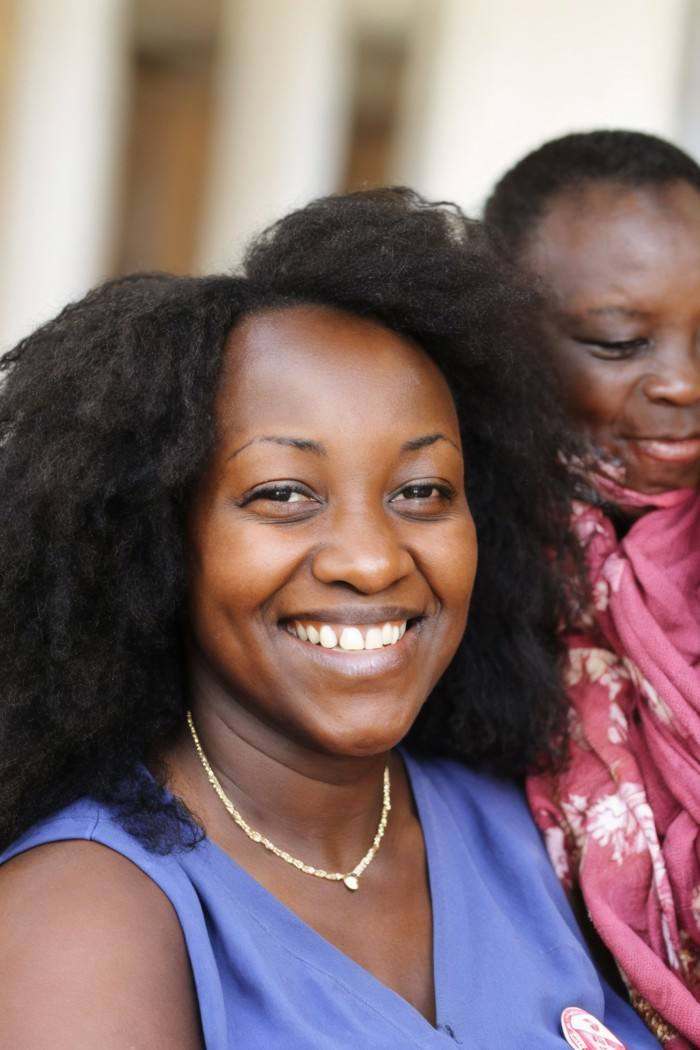 photo of a woman,  Kenyan,  head tilted with a smile on Tensor.Art