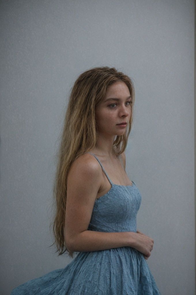 masterpiece,  a cinematic photograph of a beautiful woman wearing a blue dress,  beautiful eyes on Tensor.Art