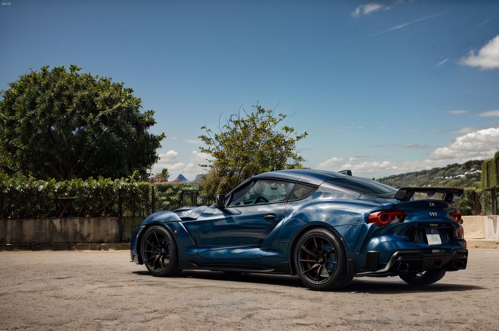 Supra A captivating image of a Supra,  its sleek silhouette painted in a mesmerizing pearlescent dark blue. The photo show...