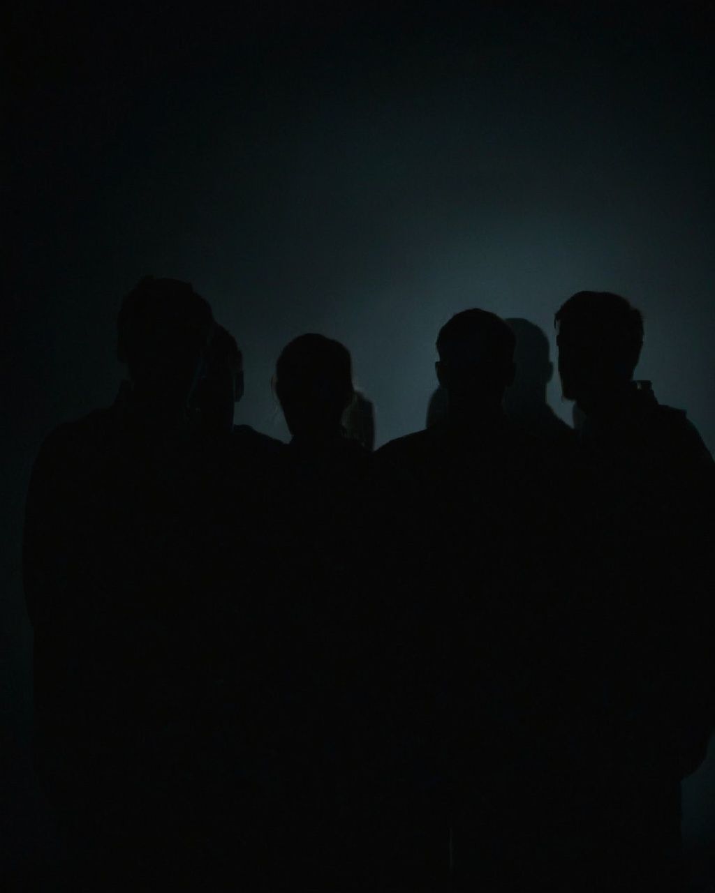 a group of people standing in the dark on Tensor.Art